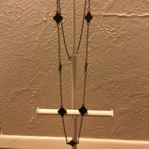 Gold necklace with black details